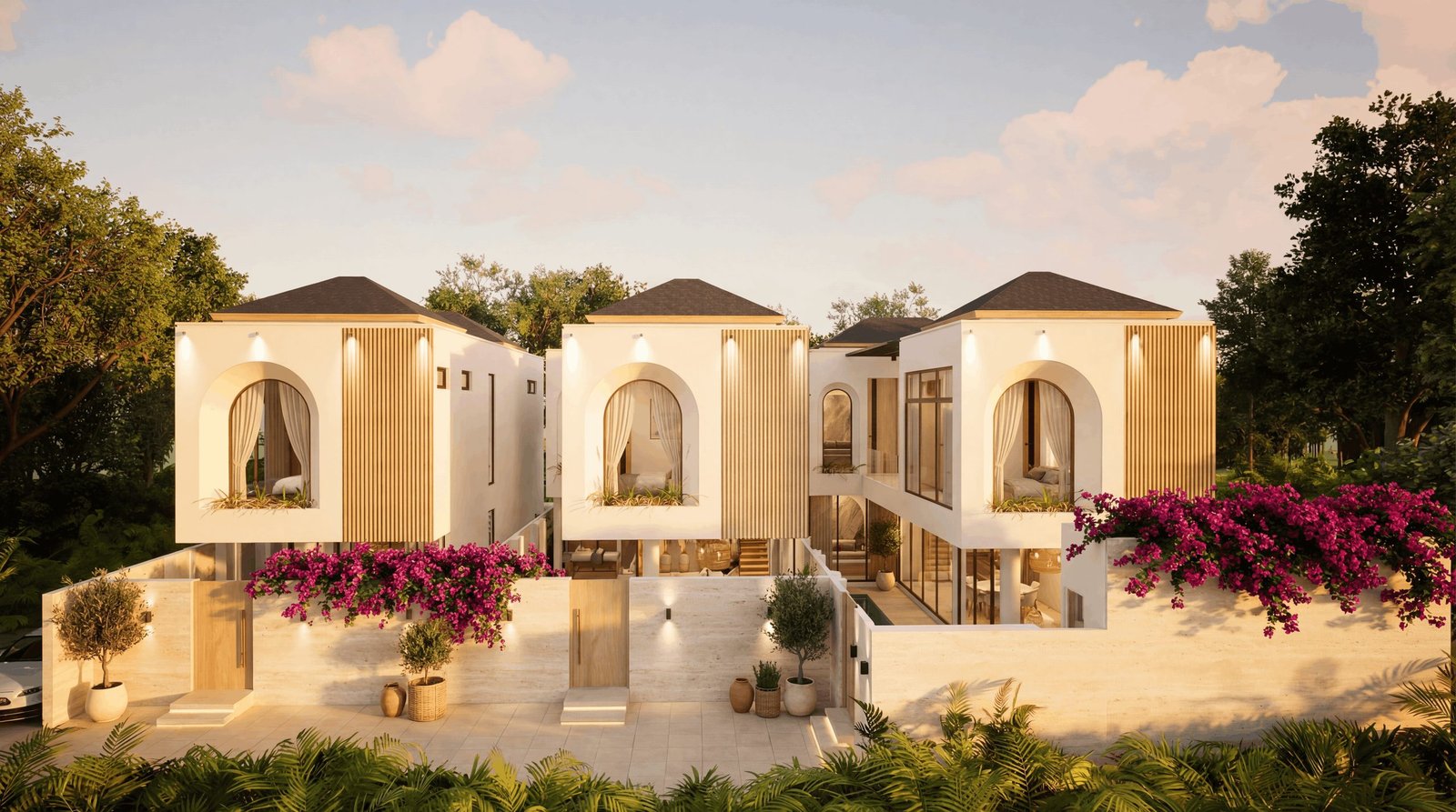 Three private villas at Nirvana, exterior view at golden hour with bougainvillea and tropical landscaping